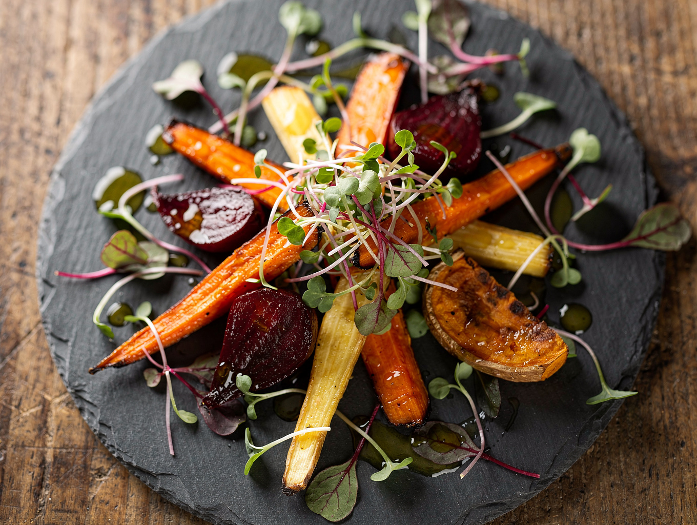 Beautifully plated farm-to-table dish on a rustic wooden table